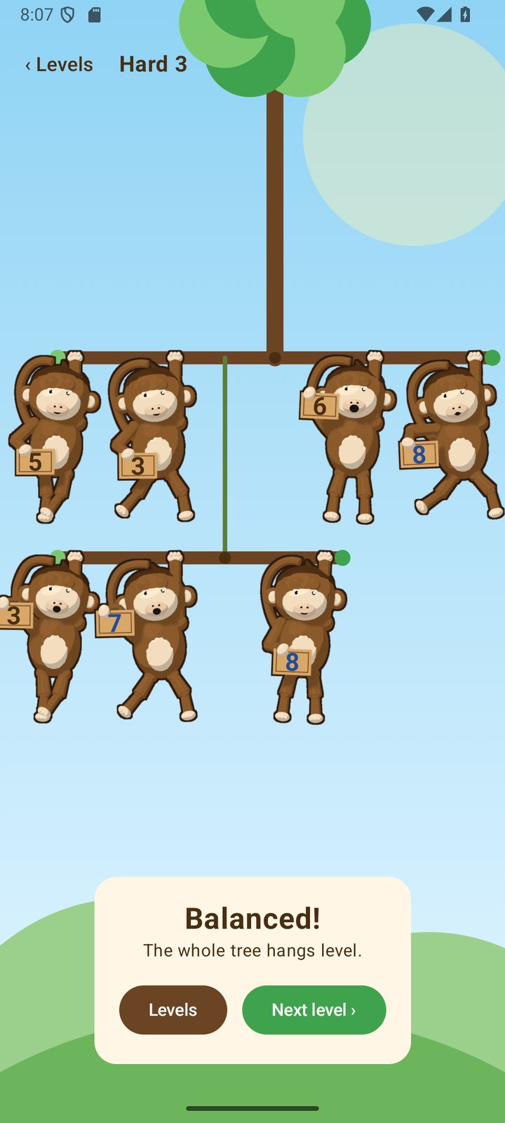A solved level with the monkeys cheering and a Balanced card offering the next level